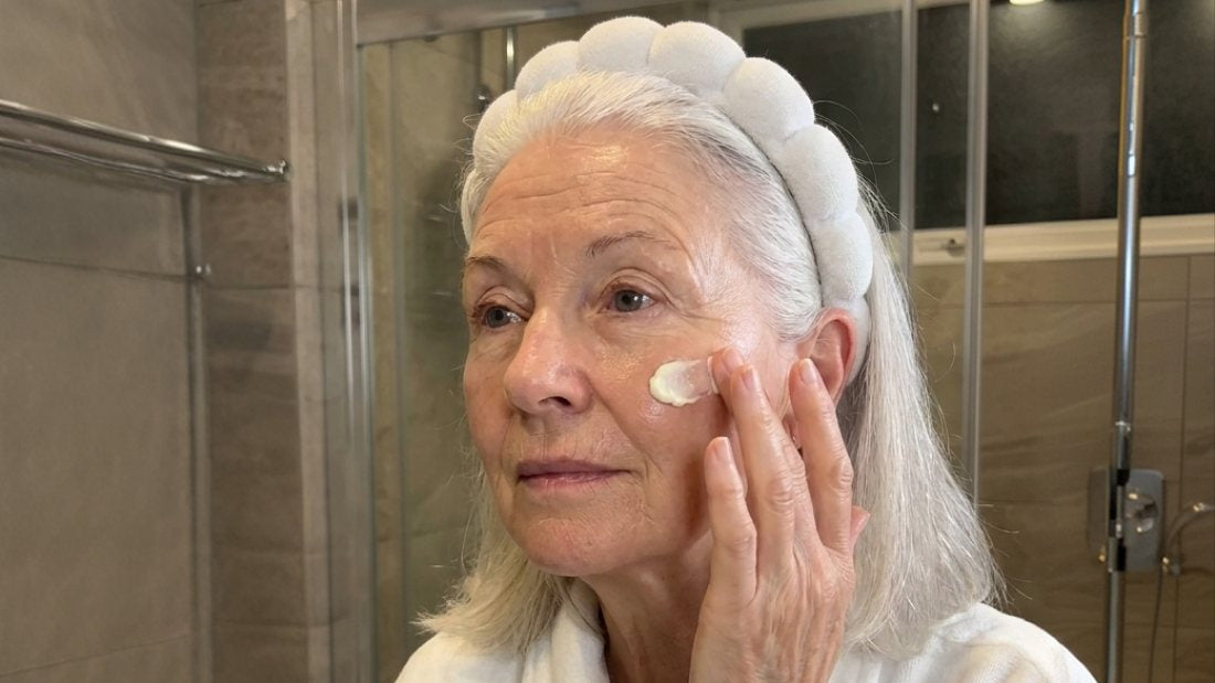 Woman applying NX1 Face Balm